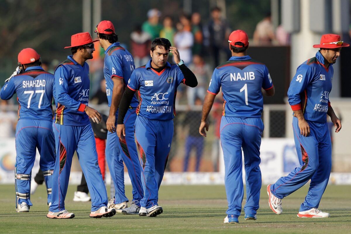 Rashid Khan celebrating with Afghanistan teammates